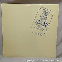 Front cover of The Who Live at Leeds vinyl album showing the album title in a coffin-shaped design at the top right corner on a plain light background.