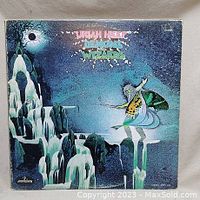 Front view of the Uriah Heep 'Demons and Wizards' vinyl album cover featuring fantasy-themed artwork.