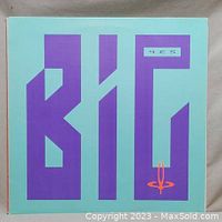 Front cover of Yes' Big Generator album showing colorful stylized text