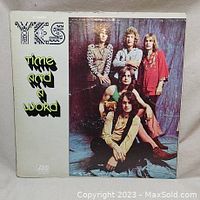 Front cover of the 'Time and a Word' album by Yes showing band members and album title.