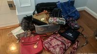 Overview of all bags in the lot showing various styles and colors.