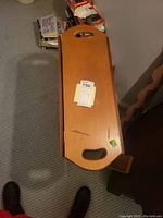 Top view of drop leaf table in closed position showing rectangular center with cut out handles