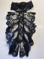 Full view of the black lace Victorian collar showing gathered ruffle and scalloped edges on a white background.