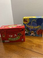 Two boxed children's games, "In A Pickle" and "Around the World," shown side by side.