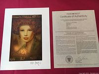 Litographic print Kapricianna by Csaba Markus with visible printed signature on white mat board alongside certificate of authenticity on paper