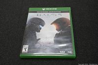 Front cover of the Halo 5 Xbox One game case showing artwork of two armored characters facing each other.