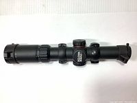 Side view of the Excalibur Over Watch crossbow scope showing the 30mm tube, adjustment knobs, and attached rings.