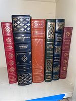 Front view of six Franklin Library hardcover books arranged side by side showing spines with titles and authors.