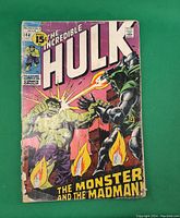 Front cover of The Incredible Hulk comic book issue 144, showing the Hulk fighting a robotic character with a purple background and a 15 cents price tag.