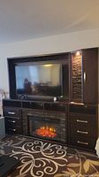 Full view of assembled wall unit with TV, fireplace, drawers and display hutch
