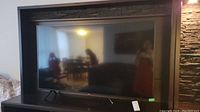 Front view of Samsung flatscreen TV showing screen and bezel