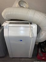 Front view of Whynter portable AC unit with exhaust hose