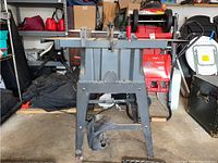 Side view of Craftsman table saw showing metal structure, saw surface, and overall condition with some rust and wear.