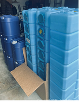 Stack of light blue WaterBrick containers and stack of dark blue containers in garage