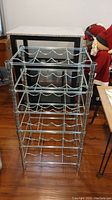Metal 24 bottle wine rack viewed from above showing multiple tiers for bottle storage