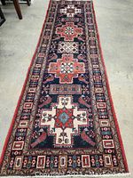 Full length view of runner on floor showing overall design and dimensions