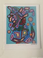 Full view of the print in plastic sleeve against wall