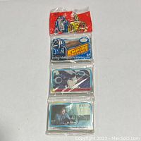 Full view of the sealed 1980 Topps Star Wars ESB trading card rack pack showing the red header with characters R2-D2 and C-3PO, middle section with movie title, and card images.