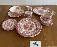 Photo of Alfred Meakin Tonquin Staffordshire ceramic dinnerware set for four, showing 4 dinner plates, salad plates, cups, saucers, large platter, and gravy cup with plate, all with red floral and scenic pattern.