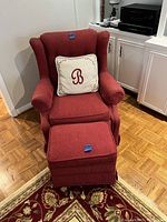Front view of red corduroy chair with matching ottoman and a decorative pillow (not included) on the chair