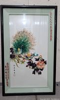 Front view of framed antique Asian wall art showing peafowl and floral painting with inscriptions.