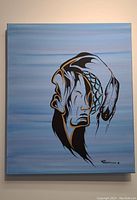 Front view of the indigenous styled painting showing a profile with feather headdress on a blue gradient background, signed bottom right.