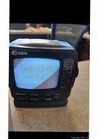 Front view of Curtis mini portable TV showing CRT screen with static and front manual controls