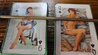 Photo showing 9 and queen of spades cards featuring nude women in vintage style photographic art for adult-themed playing cards.