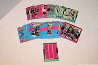 Stacks of Marvel X-Men Teams trading cards with colorful character illustrations and a checklist card prominently visible.