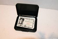 Photo of Certificate of Authenticity inside the original case emphasizing the serial number and player image.