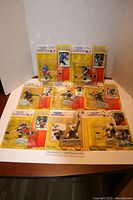 Nine sealed 1993/1994 Starting Lineup NHL player figurines arranged on table showing front packaging and player poses