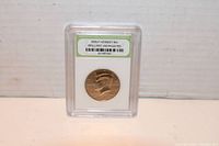 Photo of obverse side of 2005P Kennedy Half Dollar coin slabbed and labeled as Brilliant Uncirculated.