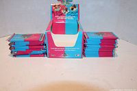 Front view of the original display box with multiple sealed trading card packs arranged on either side.