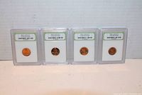 Four 1976-S Lincoln Cent coins slabbed and graded in clear plastic holders.