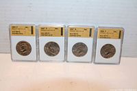 Four slabbed Kennedy Half Dollar coins graded MS70 with clear plastic SGS holders and gold labels showing year and mint marks: 2004 P, 2007 D, 2007 P, 2008 P.