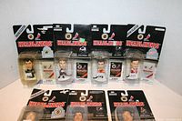 Seven sealed NHL Headliners hockey player figures arranged in two rows, all in original packaging showing front and clear plastic bubbles encapsulating each figure