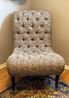 Front view of paisley tufted accent chair showing overall design