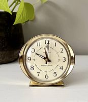 Front view of vintage Westclox Baby Ben wind-up alarm clock showing dial with Arabic numerals and clock hands.