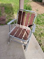 Front and partial side view showing wood slats condition and aluminum frame