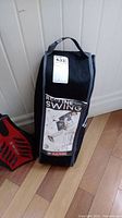 Carrying bag for recliner swinging hammock chair with handle and label showing product image and branding.