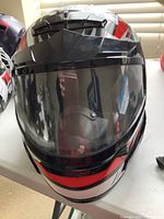 Front view of the full-face Polaris motorcycle helmet showing clear visor and graphic cover.