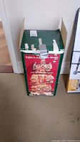 Box for Lighted Santa Tree House Decorative Figurine showing product image and details.