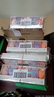 16 sealed Radiance Complexion sponge kits stacked with visible barcode labels on clear packaging.