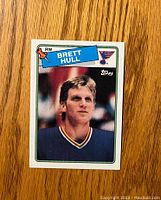Front of the 1988-89 Topps Brett Hull rookie card showing player photo, name, team, and card branding.