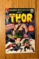 Front cover of the Journey Into Mystery Thor #124 comic book showing colorful artwork of Hercules and Thor with vintage Marvel Comics branding.