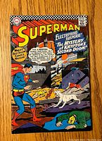 Front cover of Superman comic book issue #189 showing colorful action scene with Superman and a dog.