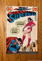 Front cover of the Superman comic book No. 261, showing a scene with Superman kneeling and a female villain commanding him.