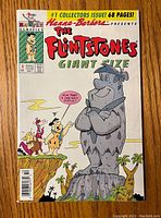 Front cover of the vintage comic, showing The Flintstones characters, title, publisher label, issue number, and pricing