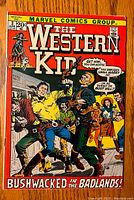 Front cover showing the title and illustrated western cowboy scene with characters and text bubbles.