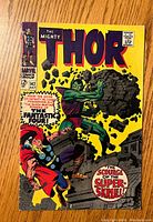 Front cover of The Mighty Thor #142 vintage comic showing main characters and title.